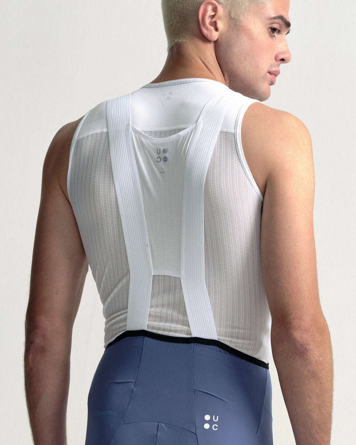 Model wearing the Men's Chroma Cargo Bib Shorts in Slate Blue.