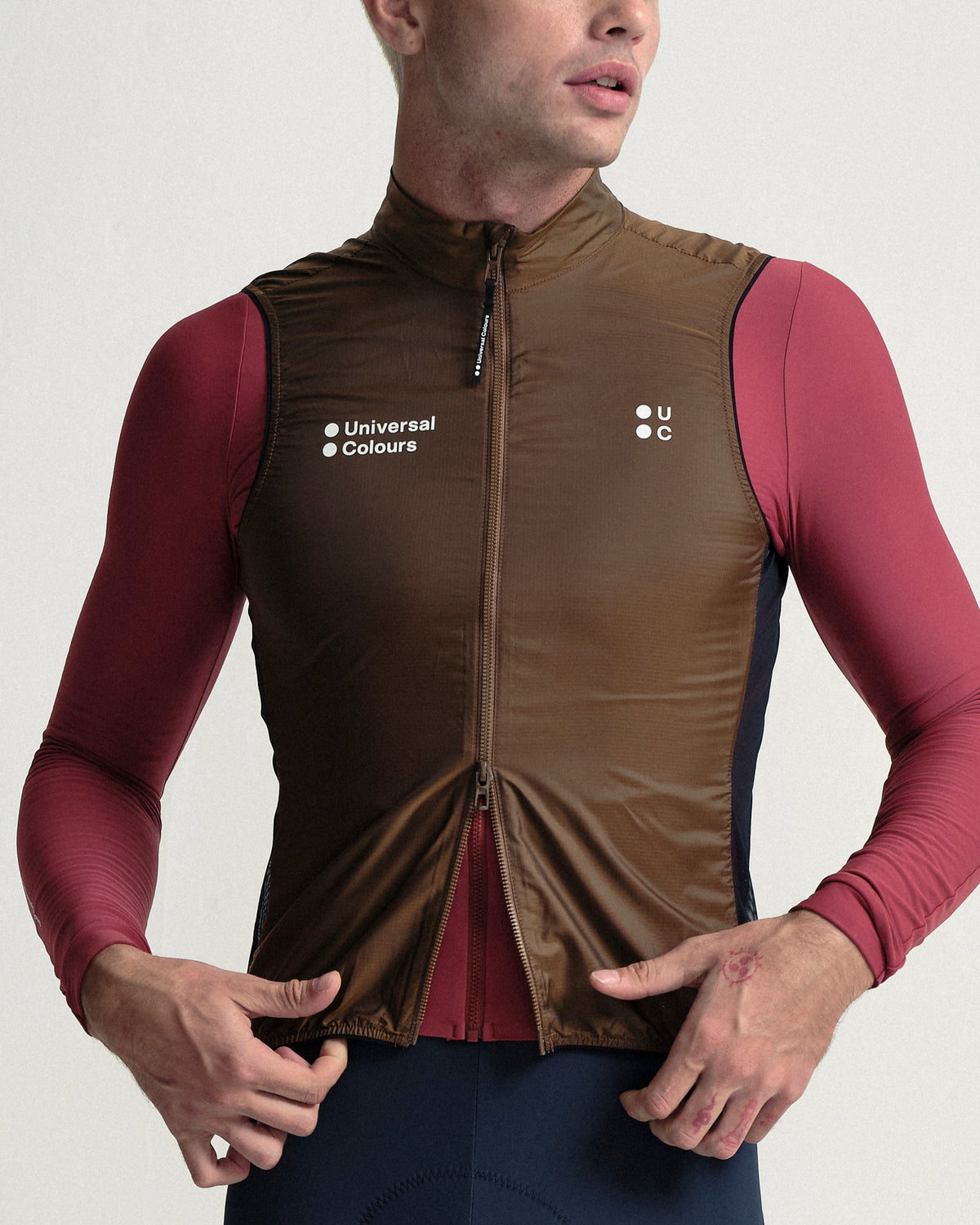 Model wearing the Men's Spectrum Gilet 2.0 in Honey Gold.