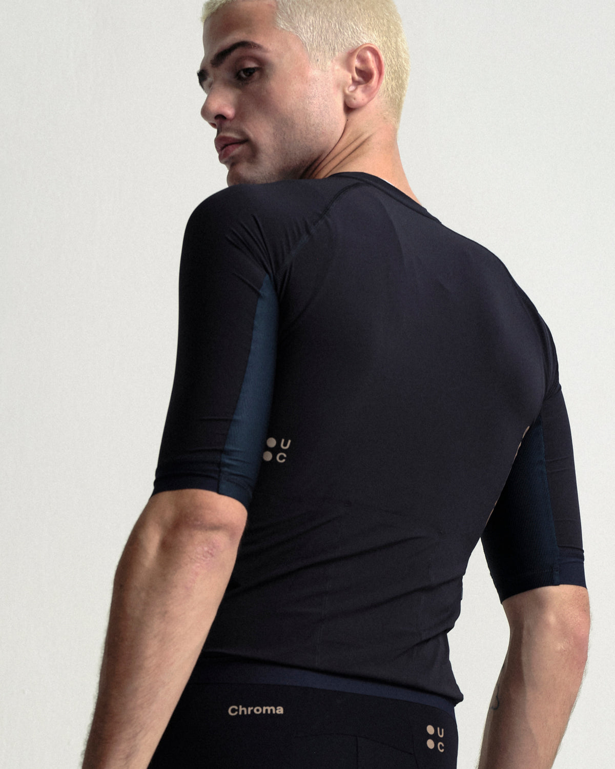 Model wearing the Men's Chroma Bib Shorts in Black/Bronze.