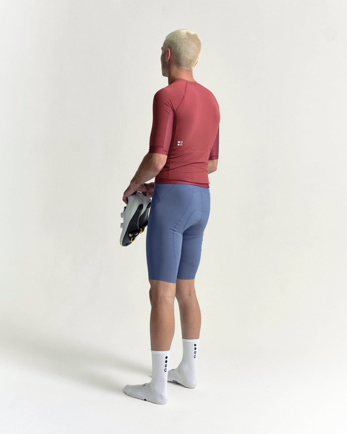 Model wearing the Men's Chroma Short Sleeve Jersey in Earth Red.