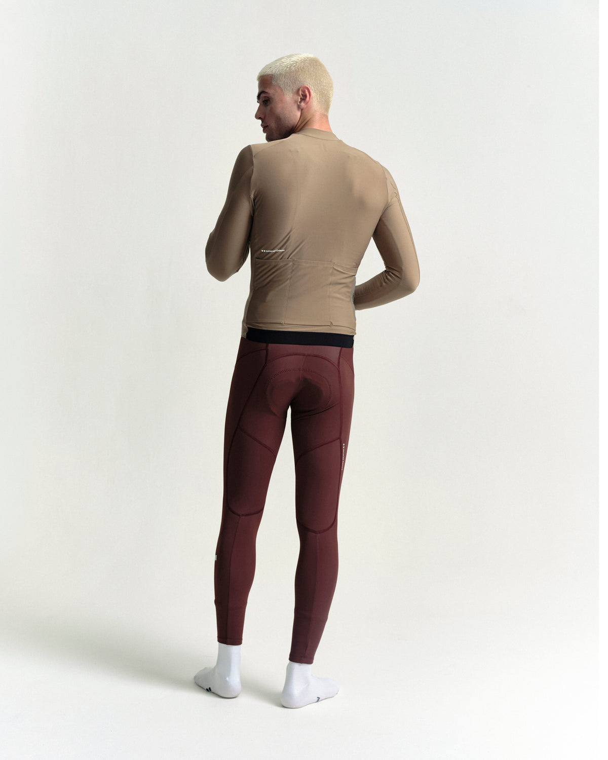 Model wearing the Men's Mono Long Sleeve Jersey in Walnut Brown.