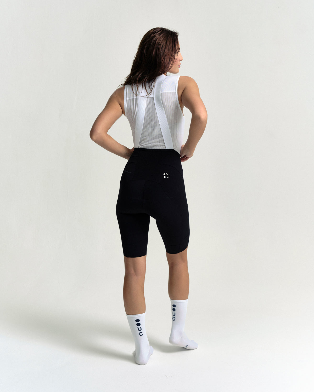 Model wearing the Women's Chroma Cargo Bib Shorts in Black.