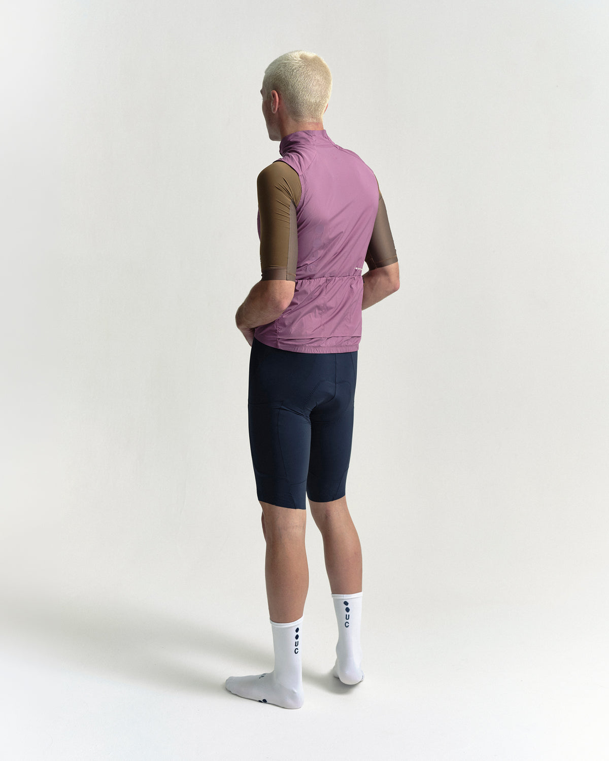 Model wearing the Men's Chroma Insulated Gilet in Dusty Rose.