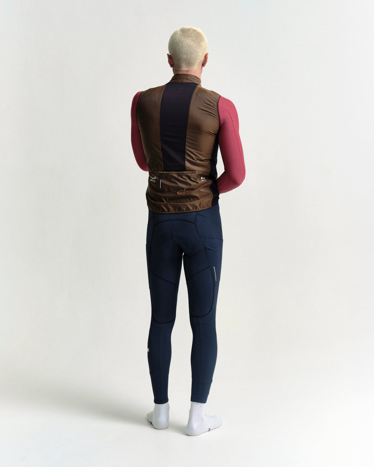 Model wearing the Men's Spectrum Gilet 2.0 in Honey Gold.